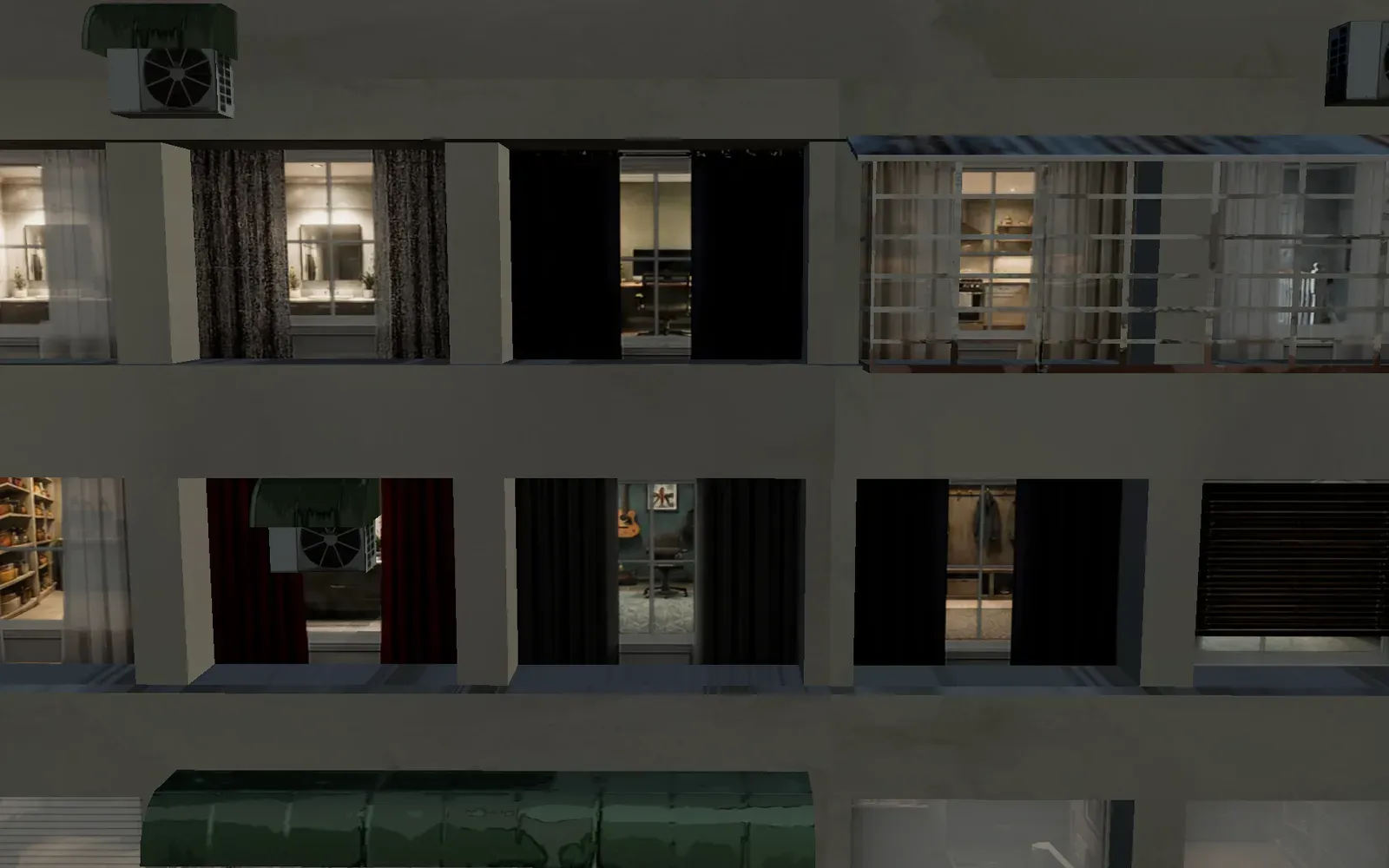 The same building at night, most of the rooms lit